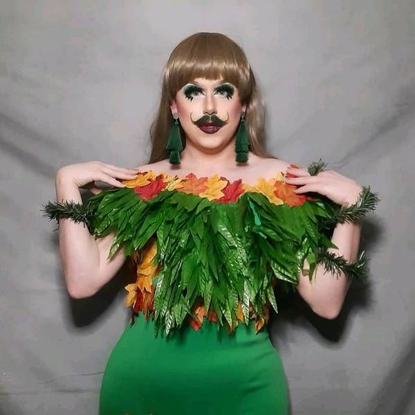 Flick in a green feather stole