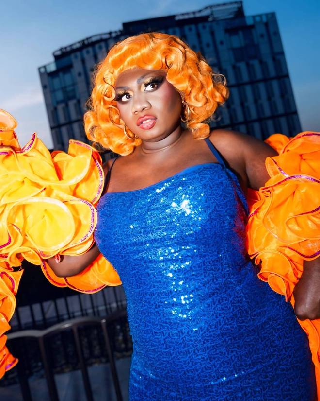 Yshee Black in a blue sequin dress